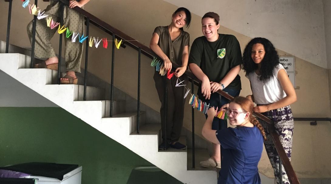 Projects Abroad interns hang origami at our Dentistry placement for high school students in Sri Lanka Teenagers hang origami decorations around a clinic during their Dentistry internship in Sri Lanka